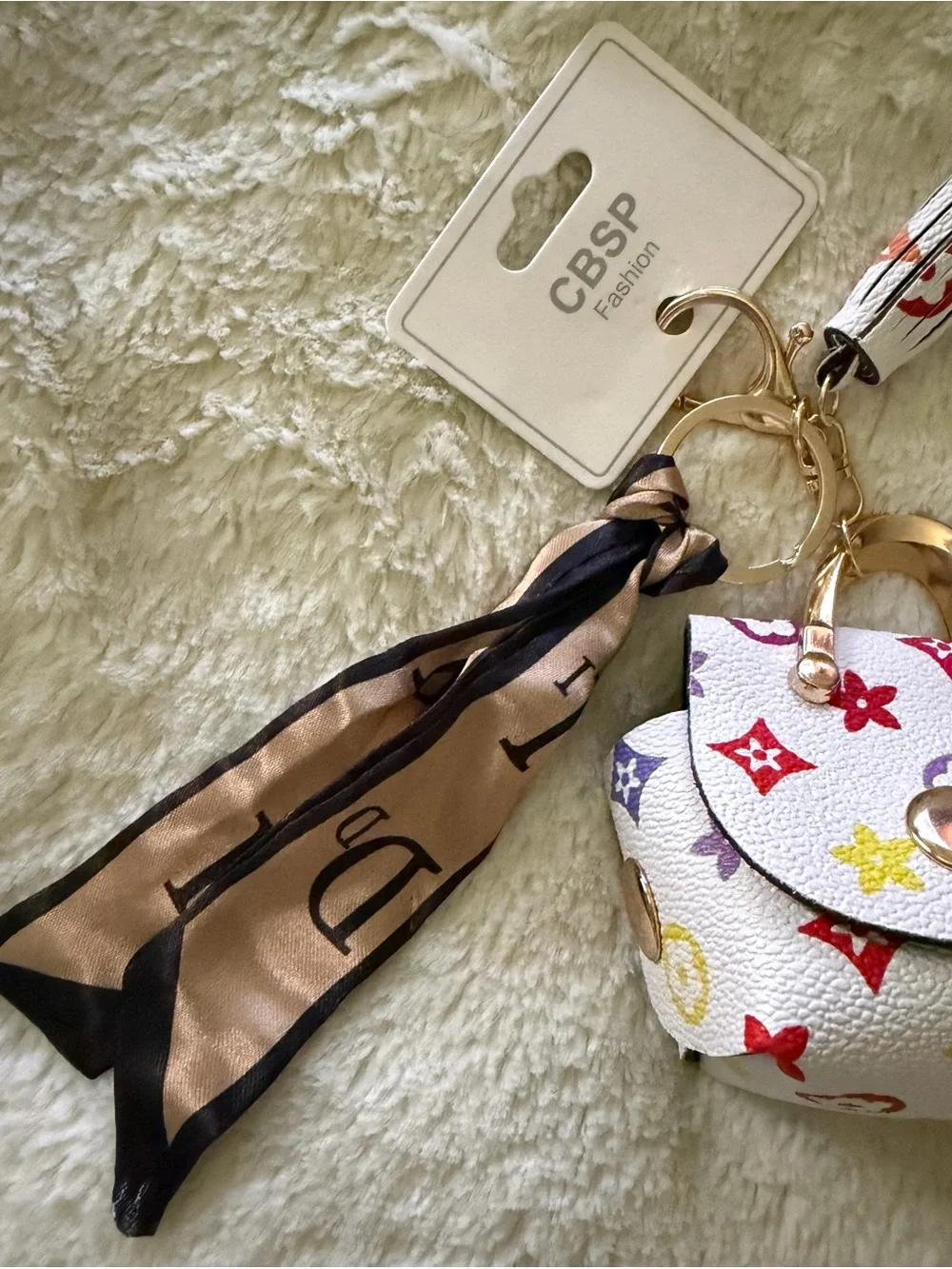NWT-Fashion-white multicolor mini bag charm/keychain with scarf accent.
